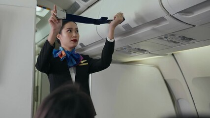 Female flight attendant demonstrating how to use a seat belt on the airplane, representing safety, service, and professional airline hospitality.