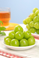 Fresh Green Grapes on White Plate with Herbal Tea - Healthy Organic Fruit Snack