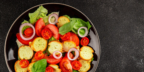 Panzanella salad tomato, croutons, onions vegetables dish natural product tasty snack fresh delicious gourmet food background on the table rustic top view copy space