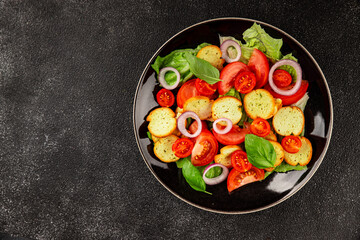 Panzanella salad tomato, croutons, onions vegetables dish natural product tasty snack fresh delicious gourmet food background on the table rustic top view copy space