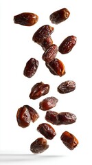 Obraz premium High-resolution photograph of dates floating in the air against a white background.