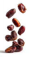 photograph of dates falling, isolated on a white background
