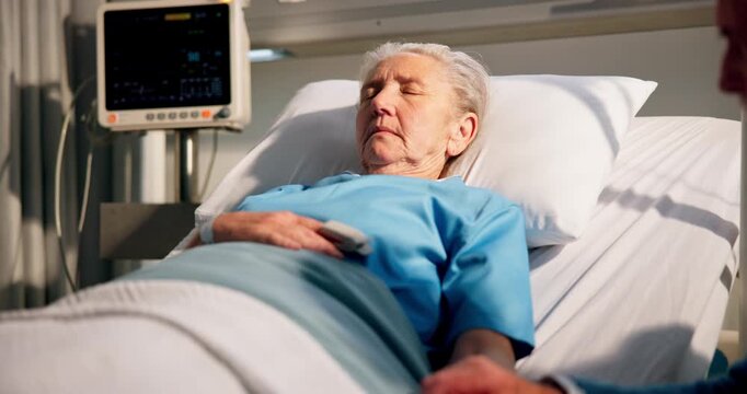 Medical, coma and senior couple in hospital with bed, support for patient in post operative care. Healthcare, sleeping and elderly people at bedside with heart monitor, diagnosis and worry in ICU.