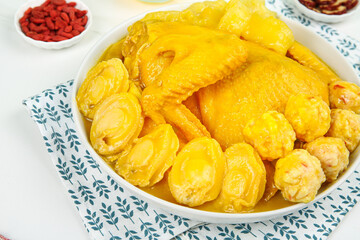 Chinese Braised Chicken in Turmeric Sauce with Vegetables and Traditional Spices