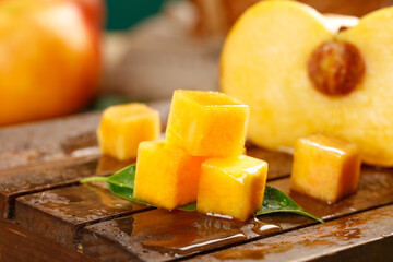Fresh Golden Peach Cubes Cut on Wooden Board - Juicy Summer Fruit Preparation