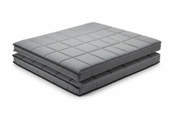 Folded Gray Foam Mattress on White Background
