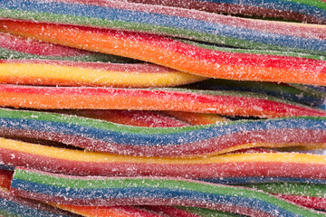 Colorful rainbow candy strips arranged in a fun, vibrant display perfect for sharing at parties or enjoying as a sweet treat