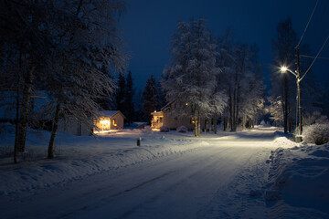 Evening street with electric lighting in a winter Swedish village