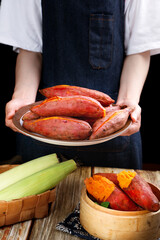 Fresh Red Sweet Potatoes and Corn Display - Healthy Organic Vegetables on Rustic Wooden Table