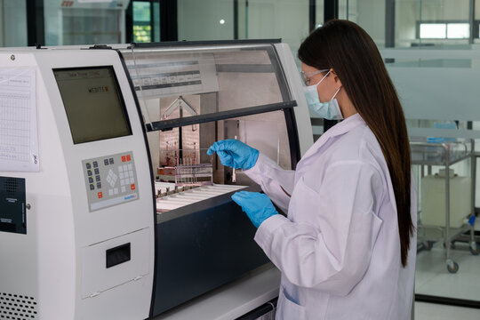 Scientist operating advanced laboratory equipment in a modern facility during a research project