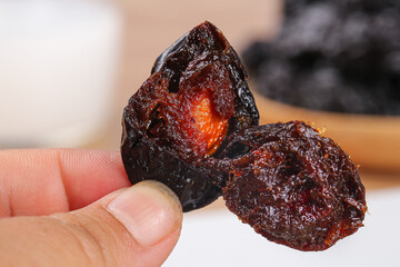 Xinjiang Dried Prunes - Hand Holding Air-Dried Fruits and Natural Preserves