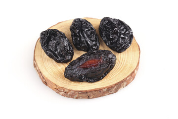 Xinjiang Air-Dried Prunes on Wooden Plate White Background Traditional Chinese Dried Fruit Healthy Snack