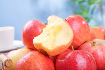 Fresh Red Fuji Apples from Aksu Xinjiang Market Display with Bitten Apple Showing White Flesh