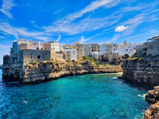 Obraz premium . Piombino view from piazza bovio. Cliffs on adriatic sea. Coastal town nestled in cliffs. Antalya old harbour view. Trani cathedral. Shoreline of some greek island.