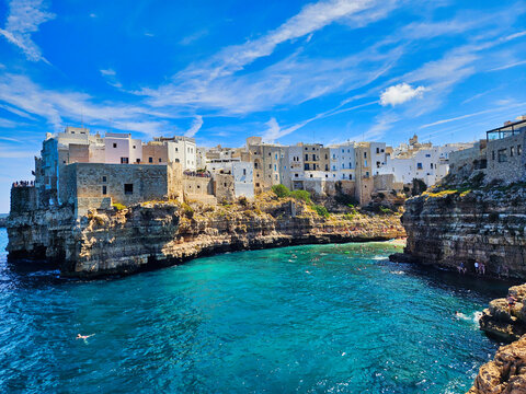   . Piombino view from piazza bovio. Cliffs on adriatic sea. Coastal town nestled in cliffs. Antalya old harbour view. Trani cathedral. Shoreline of some greek island.