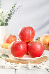 Fresh Red Gala Apples from Xinjiang Aksu Region on White Plate Kitchen Setting