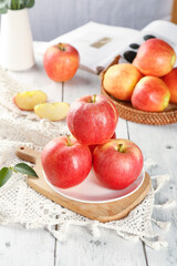 Fresh Red Aksu Sugar Heart Apples from Xinjiang with Fuji Apples on Rustic White Wooden Table - Healthy Organic Fruit Display