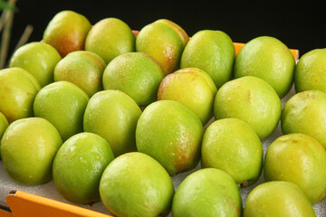 Fresh Green Plums at Market Display - Ripe Xinjiang Fruit with Natural Peel