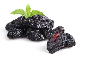Xinjiang Dried Prunes with Mint on White Background - Healthy Organic Snack Food