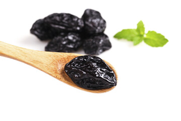 Xinjiang Dried Prunes on Wooden Spoon with Mint Leaves White Background