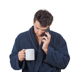 Sleepy and tired young man waking up early morning, holding a coffee mug and talking to phone as falls asleep. Fatigue male portrait wearing bathrobe isolated on transparent background