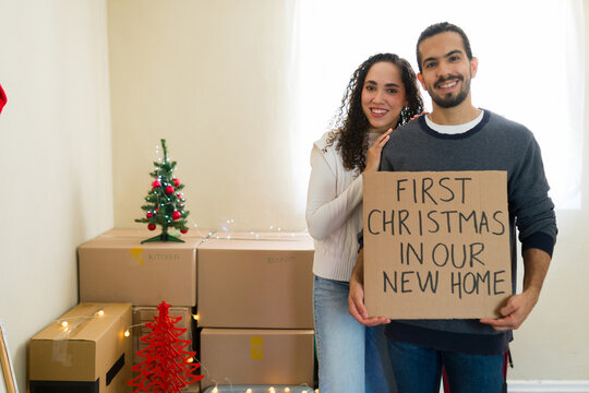 Happy couple celebrating first christmas in new home
