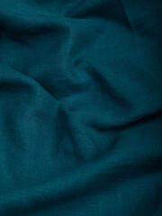 Dark dense fabric for sewing clothes, ironed, the texture of the fabric is visible