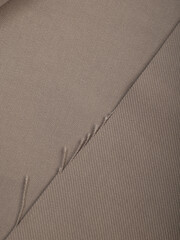 Light, dense fabric for sewing clothes, ironed, the texture of the fabric is visible
