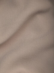 Light, dense fabric for sewing clothes, ironed, the texture of the fabric is visible