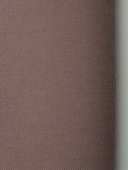 Light, dense fabric for sewing clothes, ironed, the texture of the fabric is visible