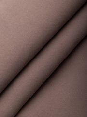 Light, dense fabric for sewing clothes, ironed, the texture of the fabric is visible