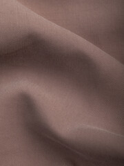 Light, dense fabric for sewing clothes, ironed, the texture of the fabric is visible