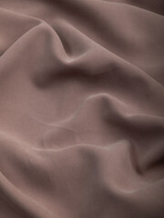 Light, dense fabric for sewing clothes, ironed, the texture of the fabric is visible