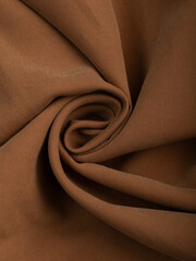 Dark dense fabric for sewing clothes, ironed, the texture of the fabric is visible