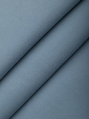 Light blue dense fabric, ironed, the texture of the fabric is visible