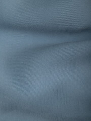 Light blue dense fabric, ironed, the texture of the fabric is visible