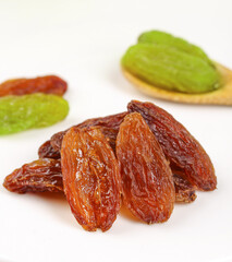 Fresh Grapes and Dried Raisins Healthy Fruit Snack Variety on White Background