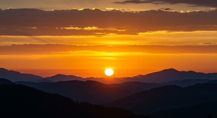 Fototapeta premium Golden Sunset Over Rolling Mountains
