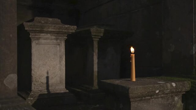 Solitary candle light reveals ancient tomb in dark crypt suitable for spooky designs, halloween backgrounds, historical illustrations, and horror concepts.