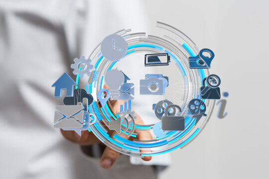 A person interacts with a digital interface showing various application icons and data connections.