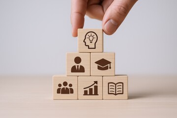 Stacking Wooden Blocks with Education and Business Icons Symbolizing Strategy, Growth, Knowledge, and Leadership