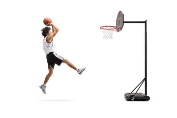 Basketball player jumping and shooting a ball