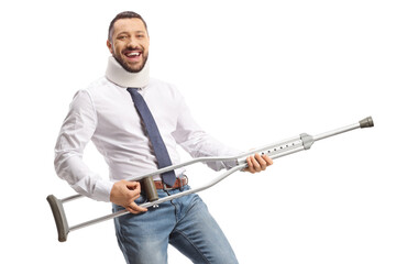 Injured man playing guitar with a crutch