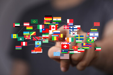 Hand interacting with a network of world flags. Global business, connection, international relations concept.