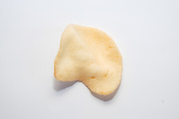 Top view of cooked shrimp crackers isolated on white background. Traditional Indonesian food concept. Copy space for text. For graphic design and banners