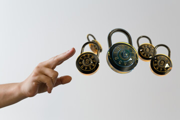 Conceptual image of security, protection, and vulnerability.  Multiple locks float in the air.