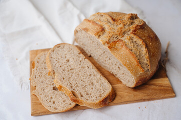 Sliced homemade whole grain sourdough bread with a rustic crust