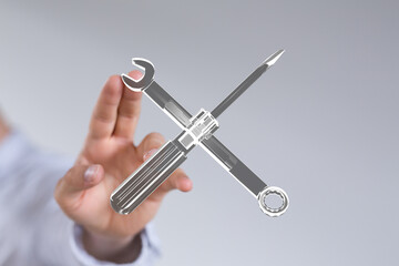 Image of a hand interacting with a digital graphic of tools, representing repair, maintenance, or technical support.