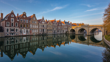 Fototapeta premium Charming historic buildings reflected in tranquil canal waters