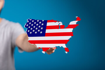 High-quality stock photo of a person presenting a US map designed with the American flag. Perfect for patriotic themes.